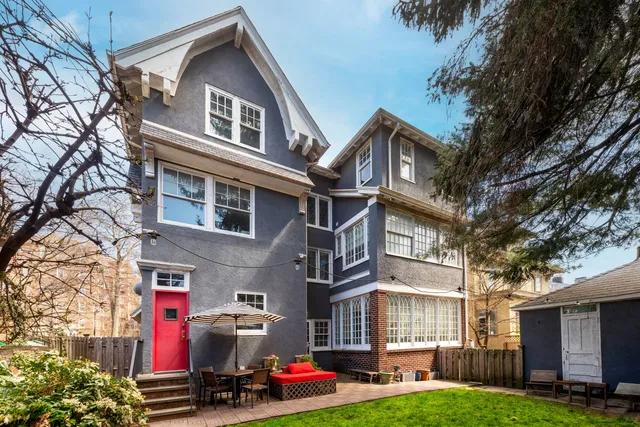a front view of residential houses with yard