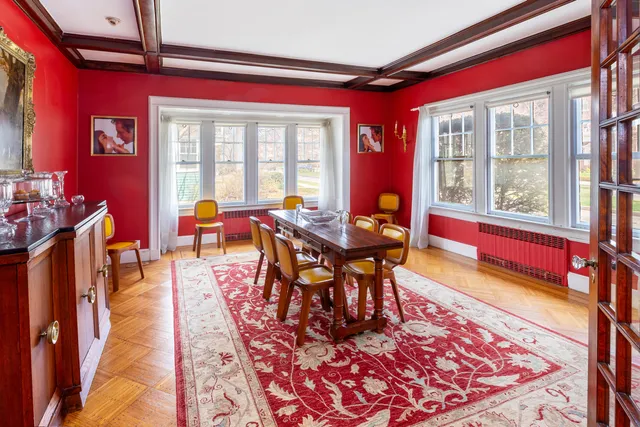 a dining room with furniture and wooden floor