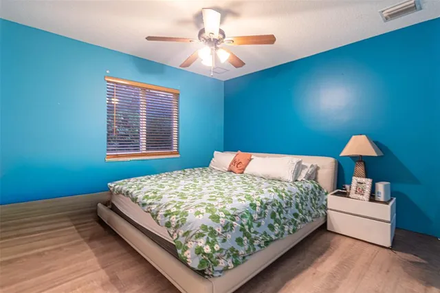 a bed room with a bed and a walk in closet