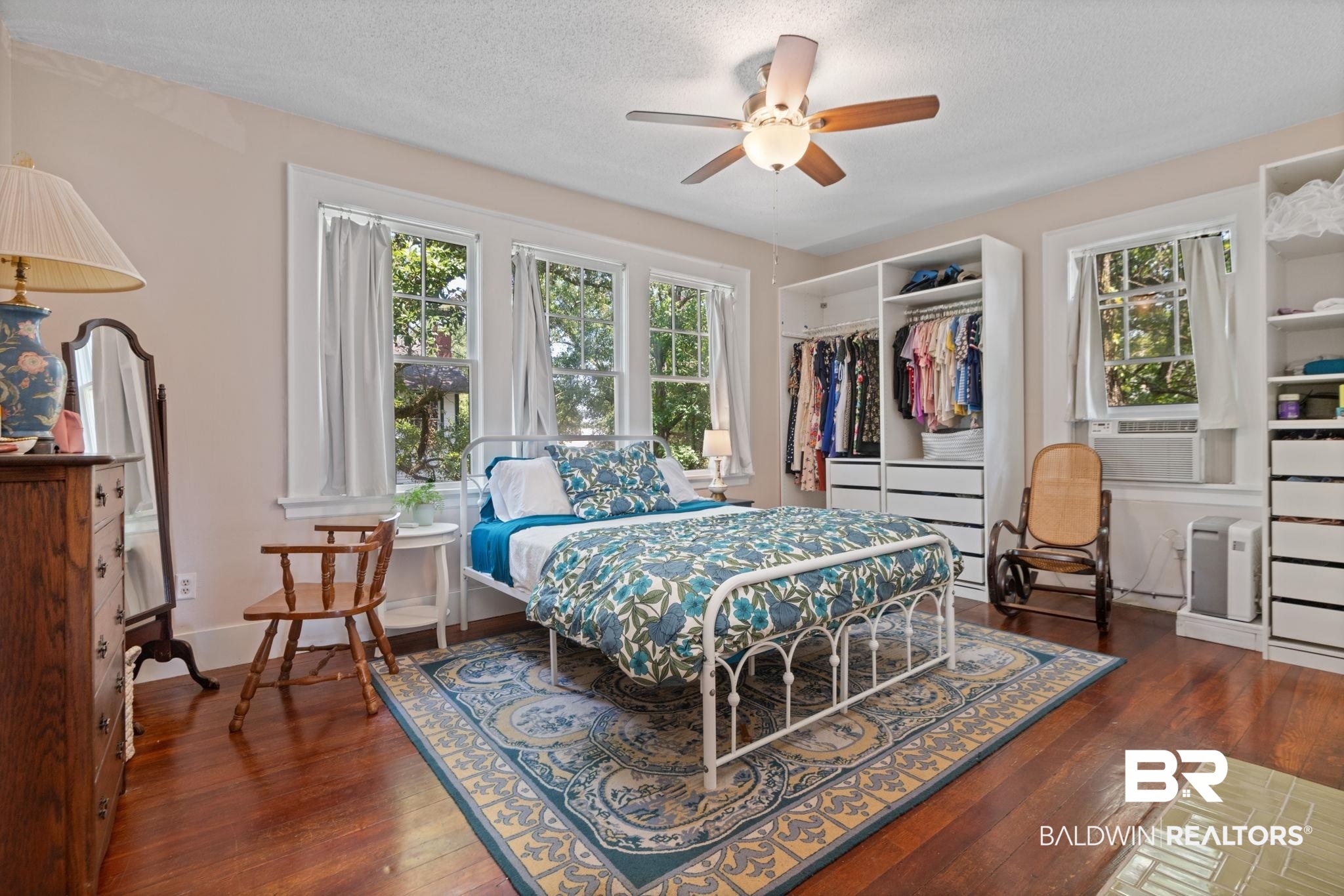 324 4th Street Mobile, AL 36611 - Photo 21 of 28 Bedroom featuring dark hardwood / wood-style flooring, a closet, a textured ceiling, and ceiling fan
