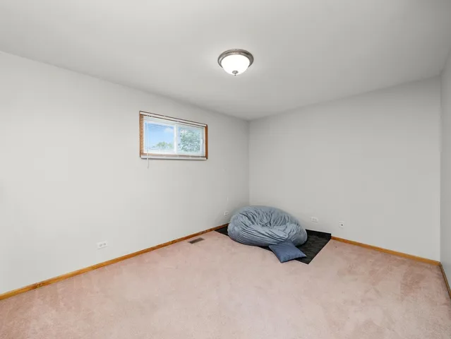 a bathroom with a sink a toilet and shower curtain
