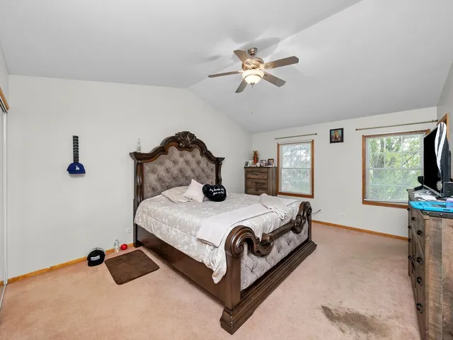 a bedroom with a bed and window