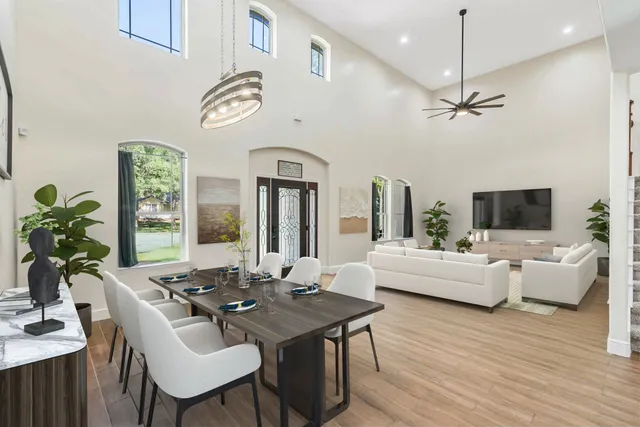 a view of a dining room with furniture window and wooden floor