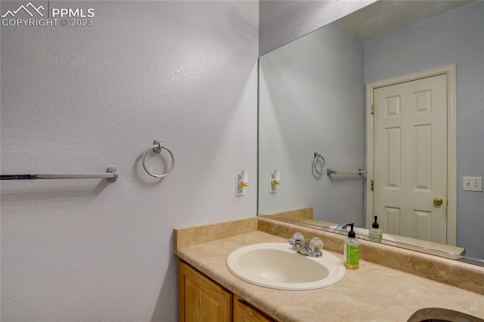 7730 Midnight Road Peyton, CO 80831 - Photo 11 of 50 Main floor 1/2 bath
