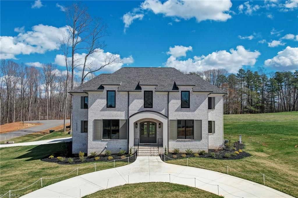 6806 Brennan Way Oak Ridge, NC 27310 - Photo 1 of 50 Welcome home! Front exterior of this stately home pictured with circle drive.