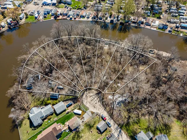 aerial view of a house with a lake view