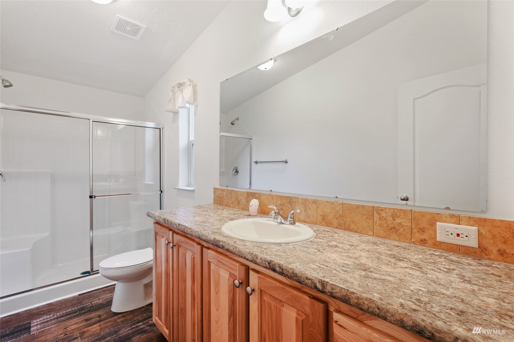 18737 Hilt Street Southwest Rochester, WA 98579 - Photo 14 of 29 a bathroom with a granite countertop sink toilet and shower