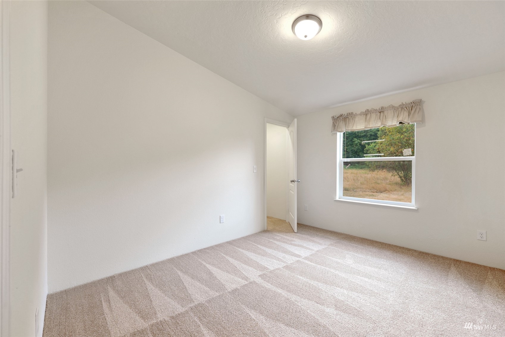 18737 Hilt Street Southwest Rochester, WA 98579 - Photo 16 of 29 an empty room with windows
