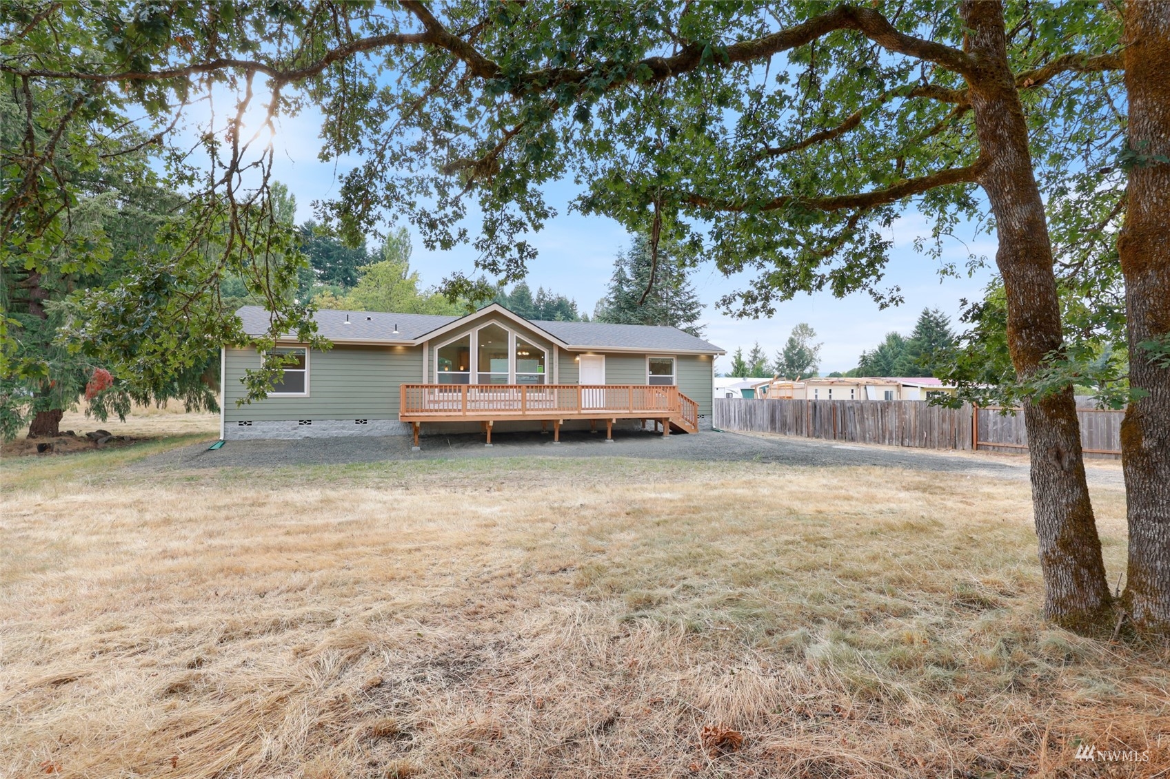 18737 Hilt Street Southwest Rochester, WA 98579 - Photo 23 of 29 a front view of a house with a yard and trees