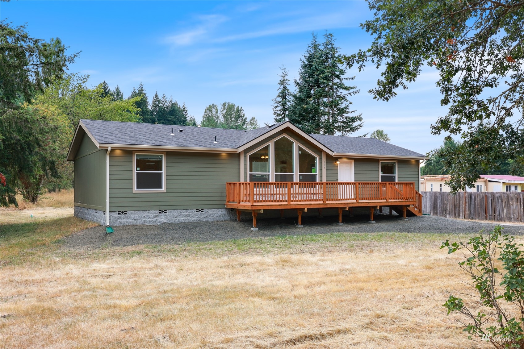 18737 Hilt Street Southwest Rochester, WA 98579 - Photo 24 of 29 a view of a house with a yard and wooden fence