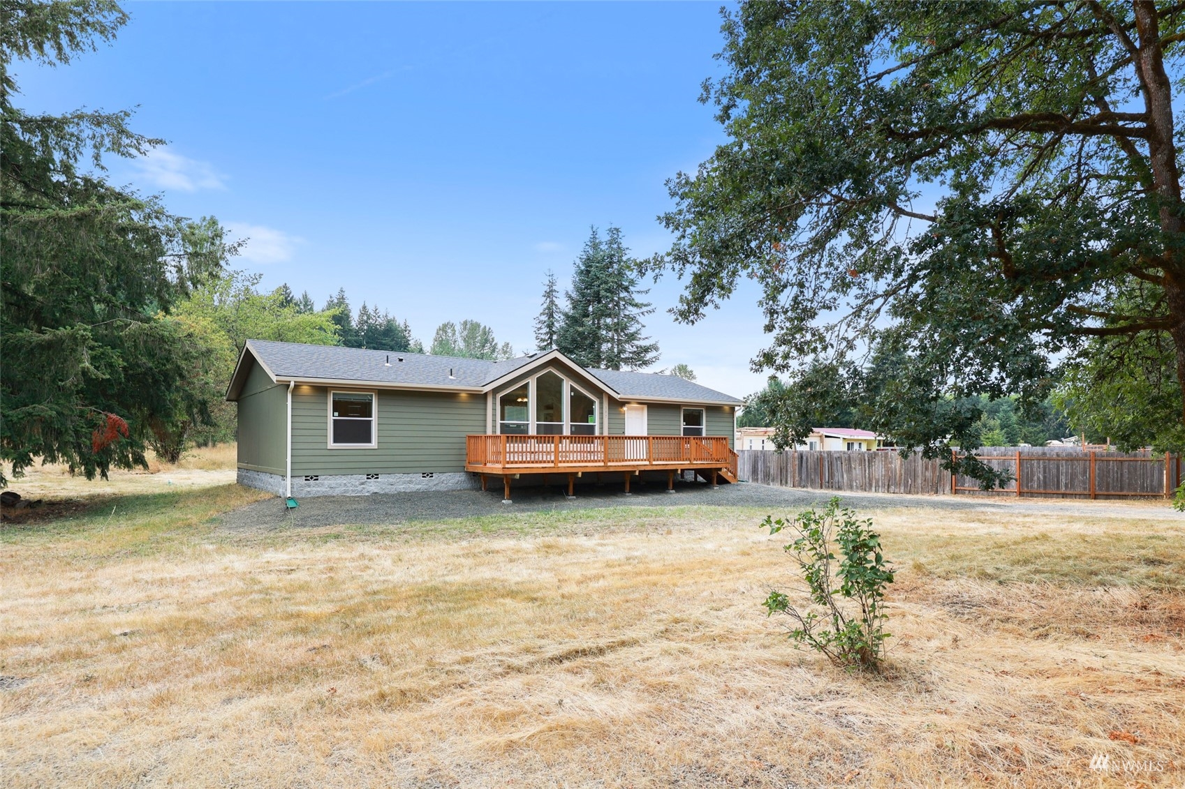 18737 Hilt Street Southwest Rochester, WA 98579 - Photo 25 of 29 a house that has a tree in front of it