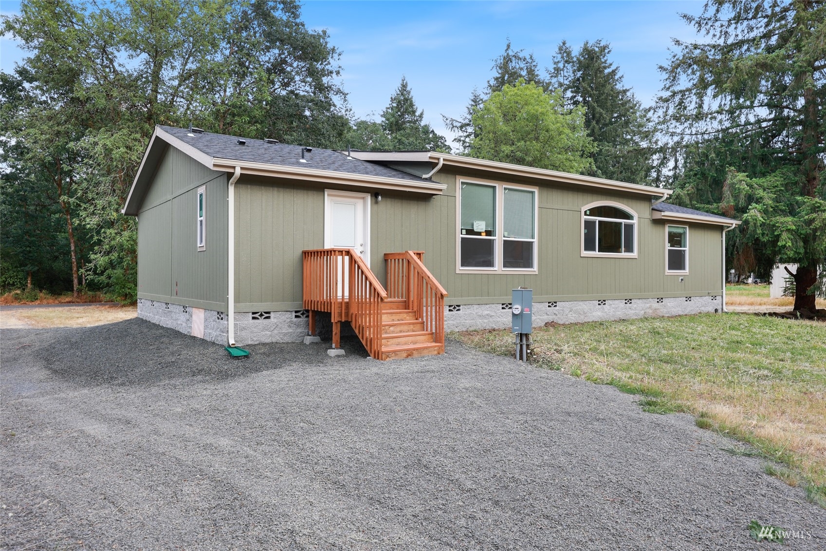 18737 Hilt Street Southwest Rochester, WA 98579 - Photo 28 of 29 a view of backyard of house with wooden fence and trees