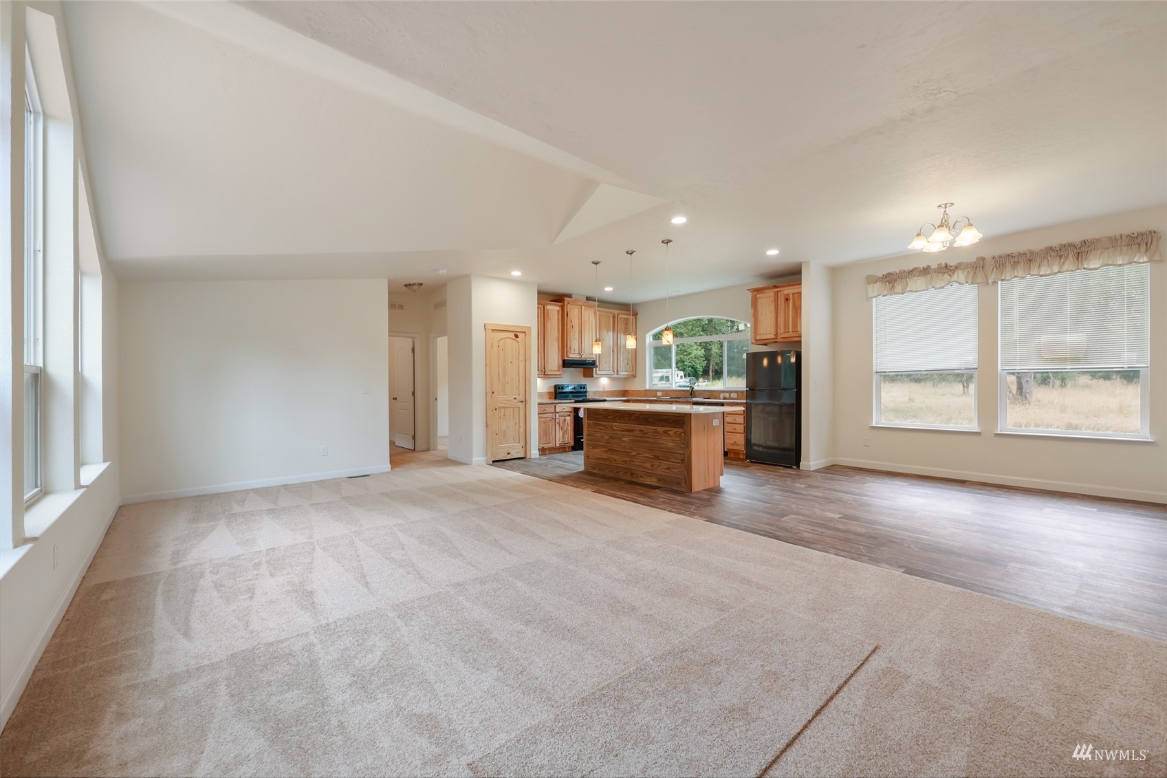 18737 Hilt Street Southwest Rochester, WA 98579 - Photo 3 of 29 a view of an empty room with a window and kitchen view