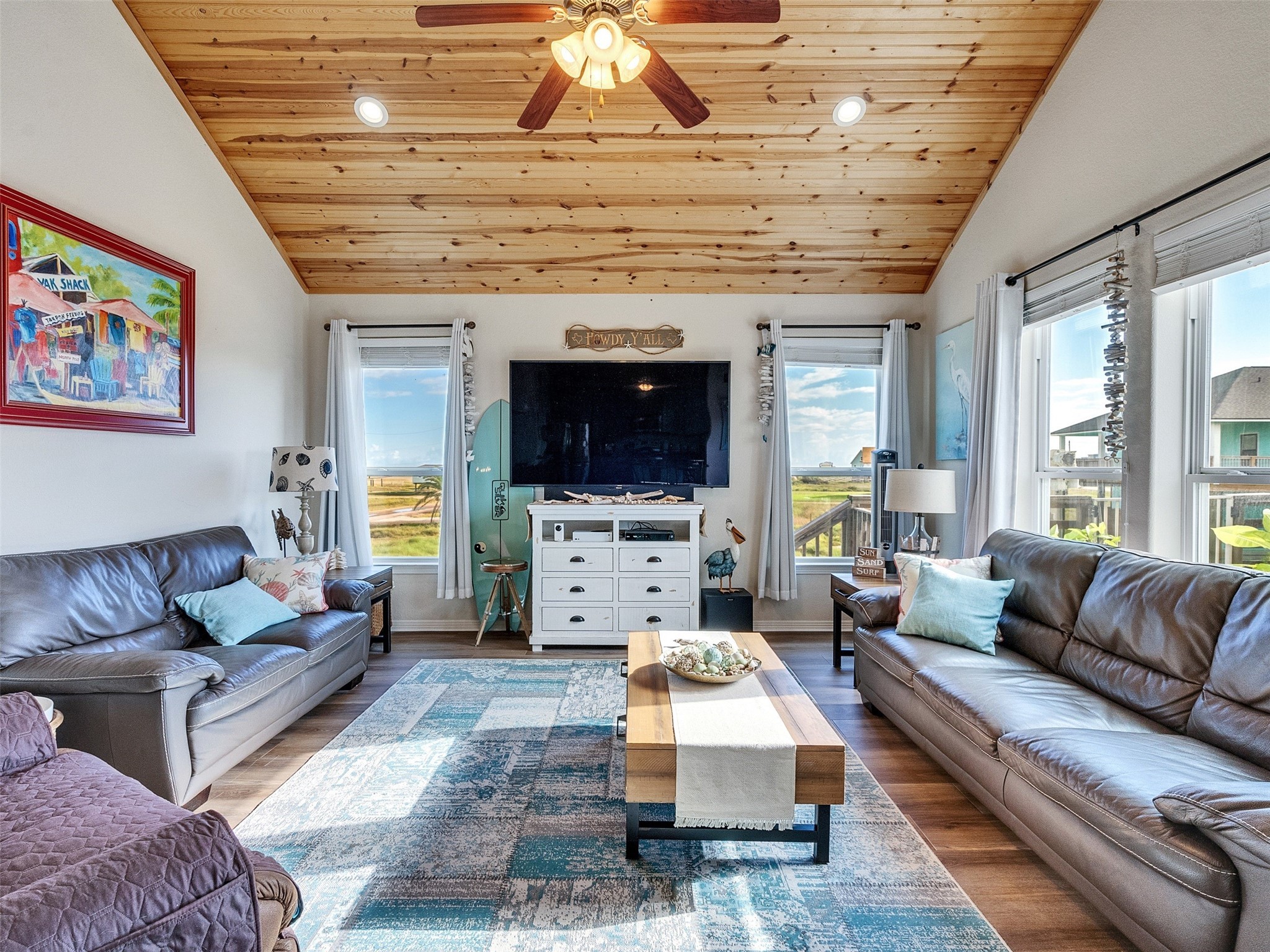 4710 Palm Street Freeport, TX 77541 - Photo 11 of 23 a living room with furniture and a flat screen tv