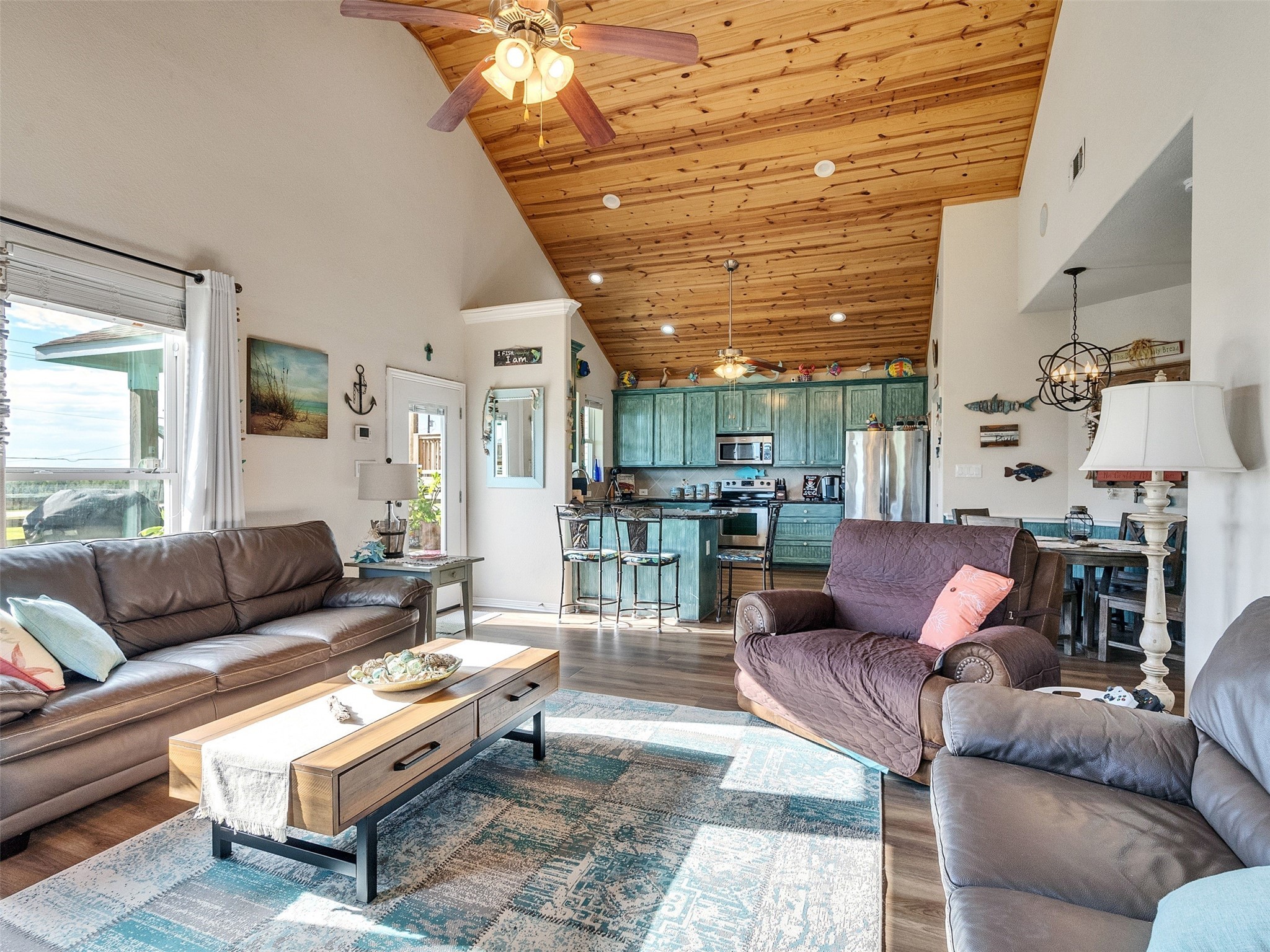 4710 Palm Street Freeport, TX 77541 - Photo 13 of 23 a living room with furniture and a chandelier