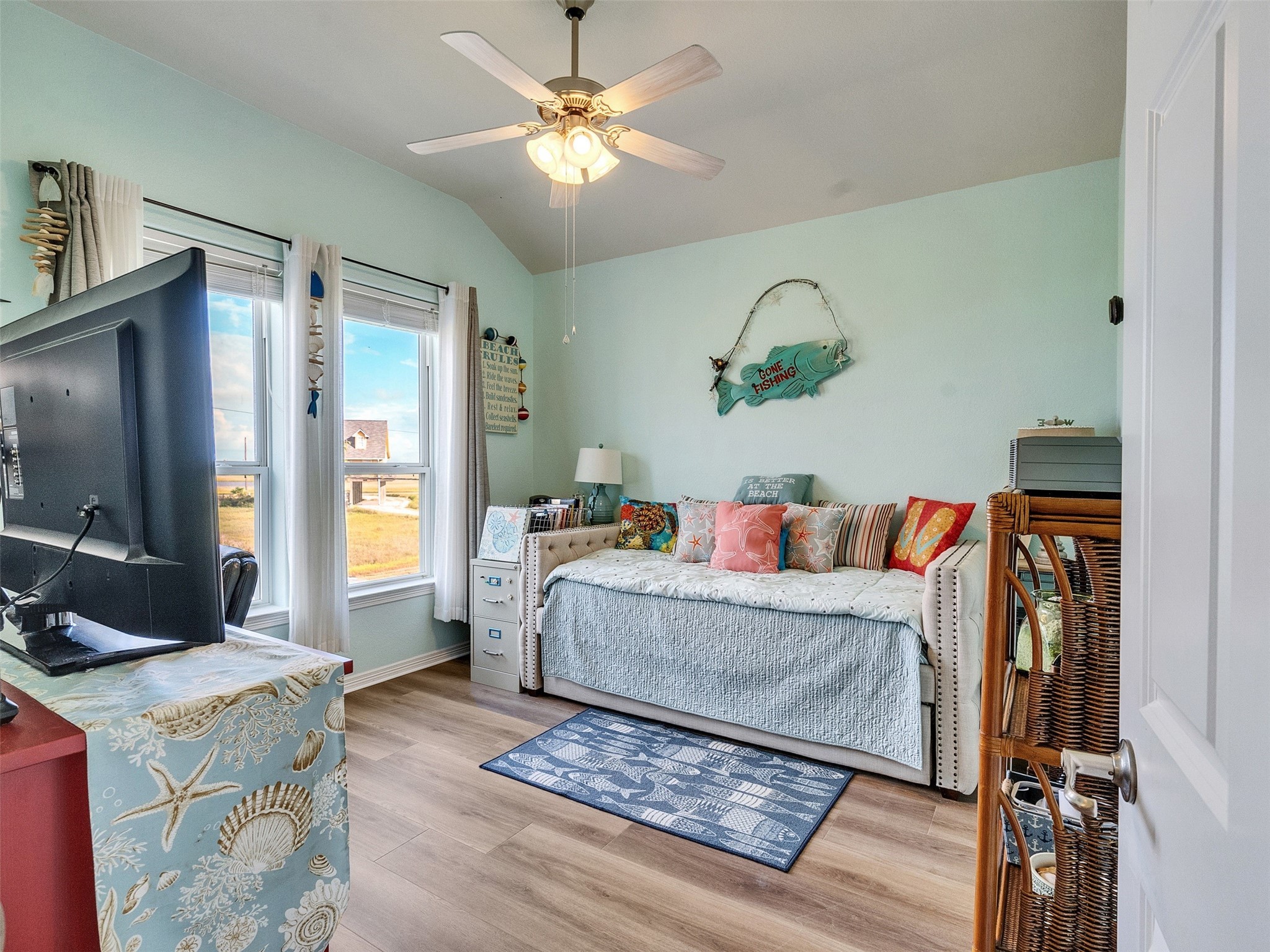 4710 Palm Street Freeport, TX 77541 - Photo 21 of 23 a living room with furniture and a flat screen tv