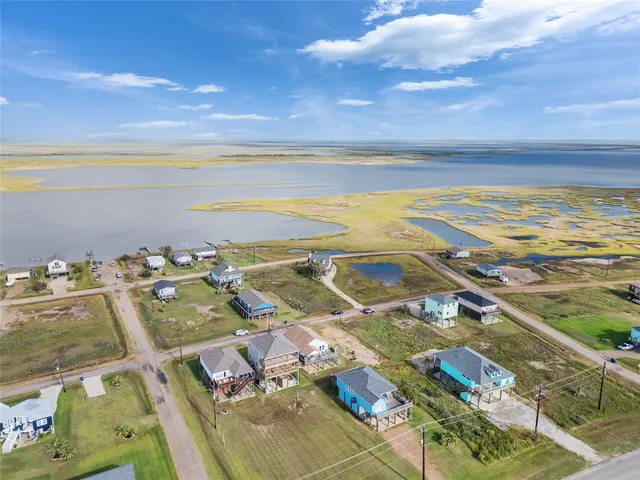 a view of a chairs and table in the patio