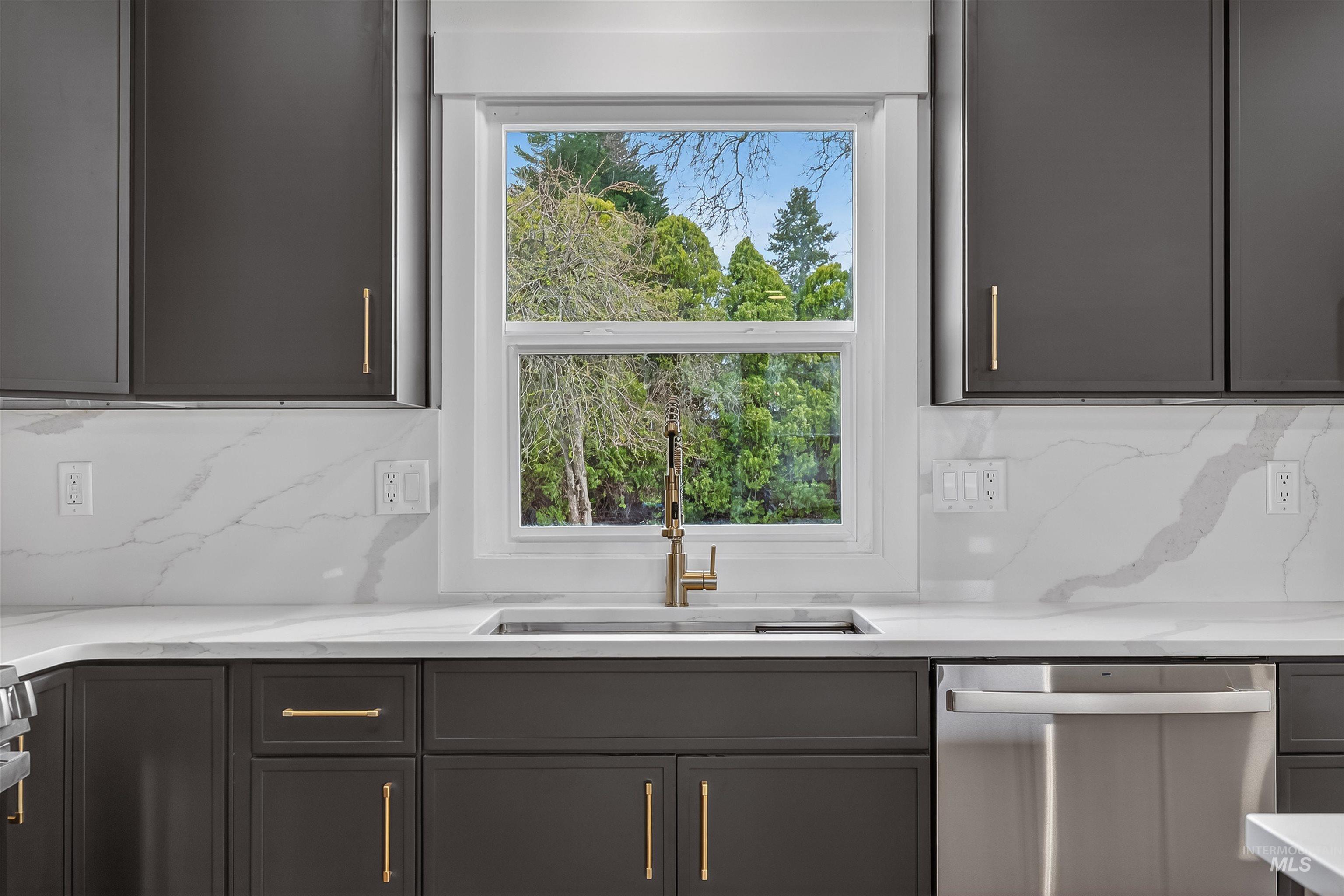 3513 8th Street Lewiston, ID 83501 - Photo 14 of 41 Kitchen featuring dishwasher, decorative backsplash, and light stone counters
