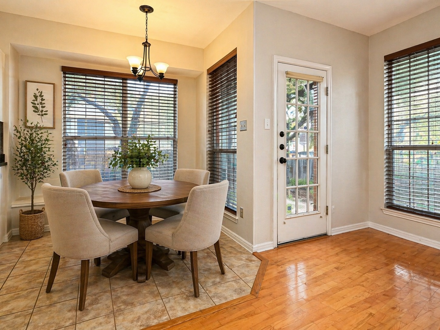 11017 Rio Vista Drive Austin, TX 78726 - Photo 19 of 38 Virtually-staged: Breakfast nook featuring a bay window, wood-finish blinds, and a multi-light chandelier