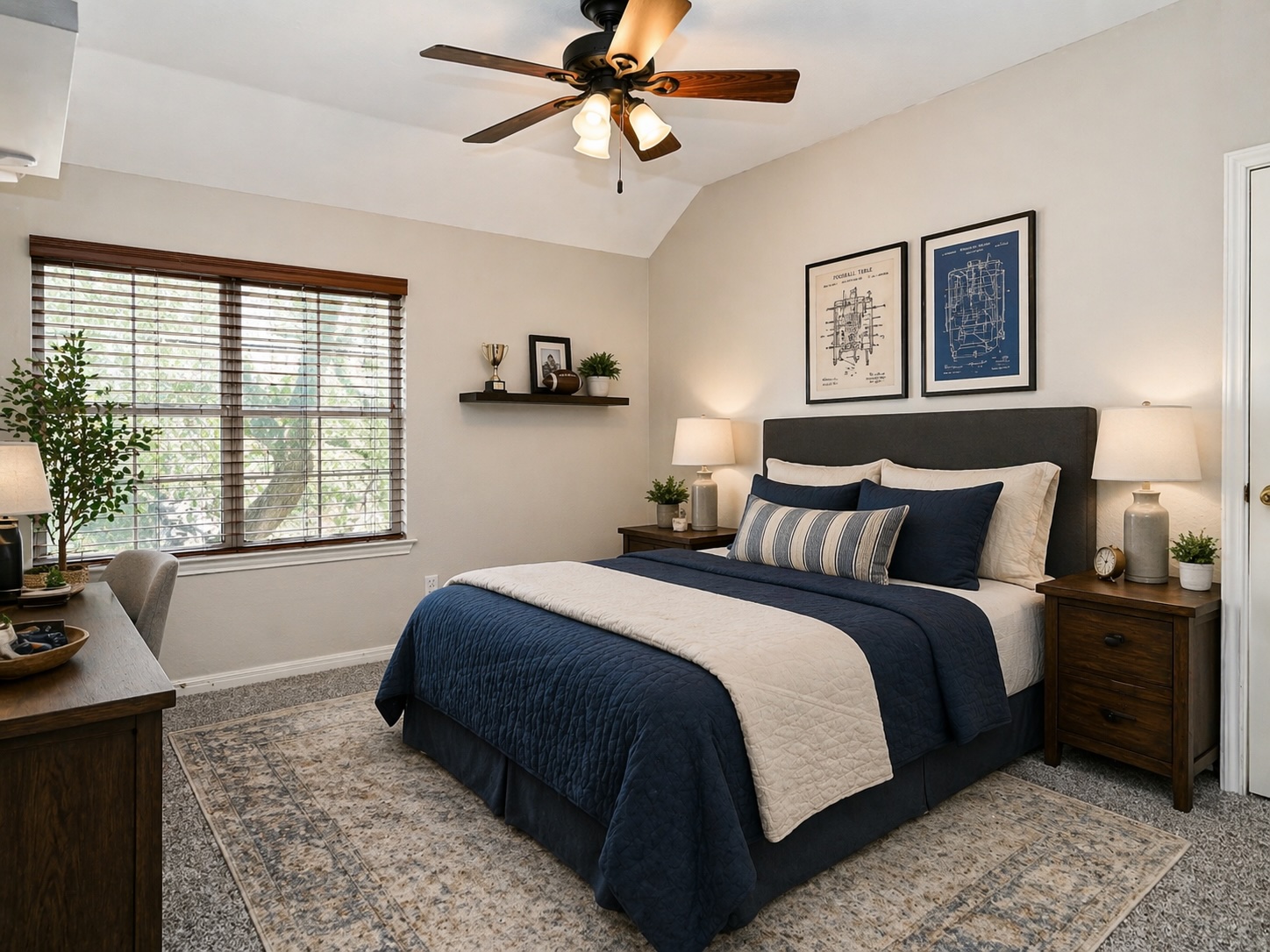 11017 Rio Vista Drive Austin, TX 78726 - Photo 27 of 38 Virtually-staged: Carpeted bedroom featuring a vaulted ceiling with a ceiling fan, a large window with wood-finish blinds, and a built-in wall shelf