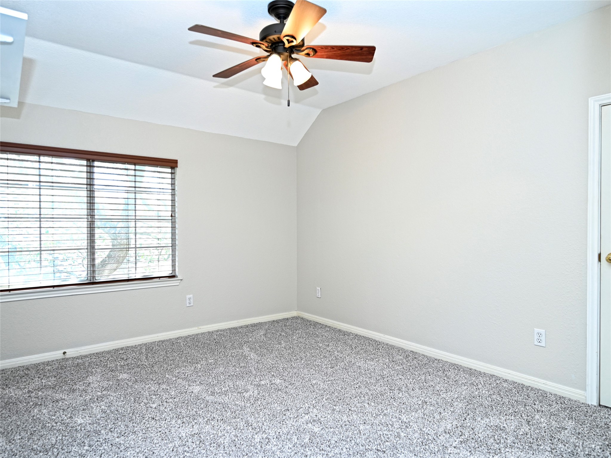 11017 Rio Vista Drive Austin, TX 78726 - Photo 28 of 38 Carpeted room featuring a ceiling fan with integrated lighting, a window with horizontal blinds and wood-finish trim, and neutral wall tones