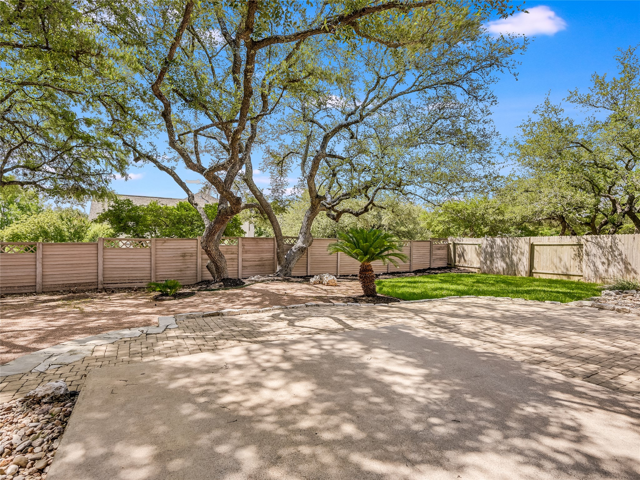 11017 Rio Vista Drive Austin, TX 78726 - Photo 37 of 38 Expansive outdoor area featuring mature trees providing natural shade