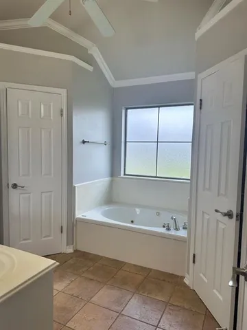 a bathroom with a bathtub and a shower
