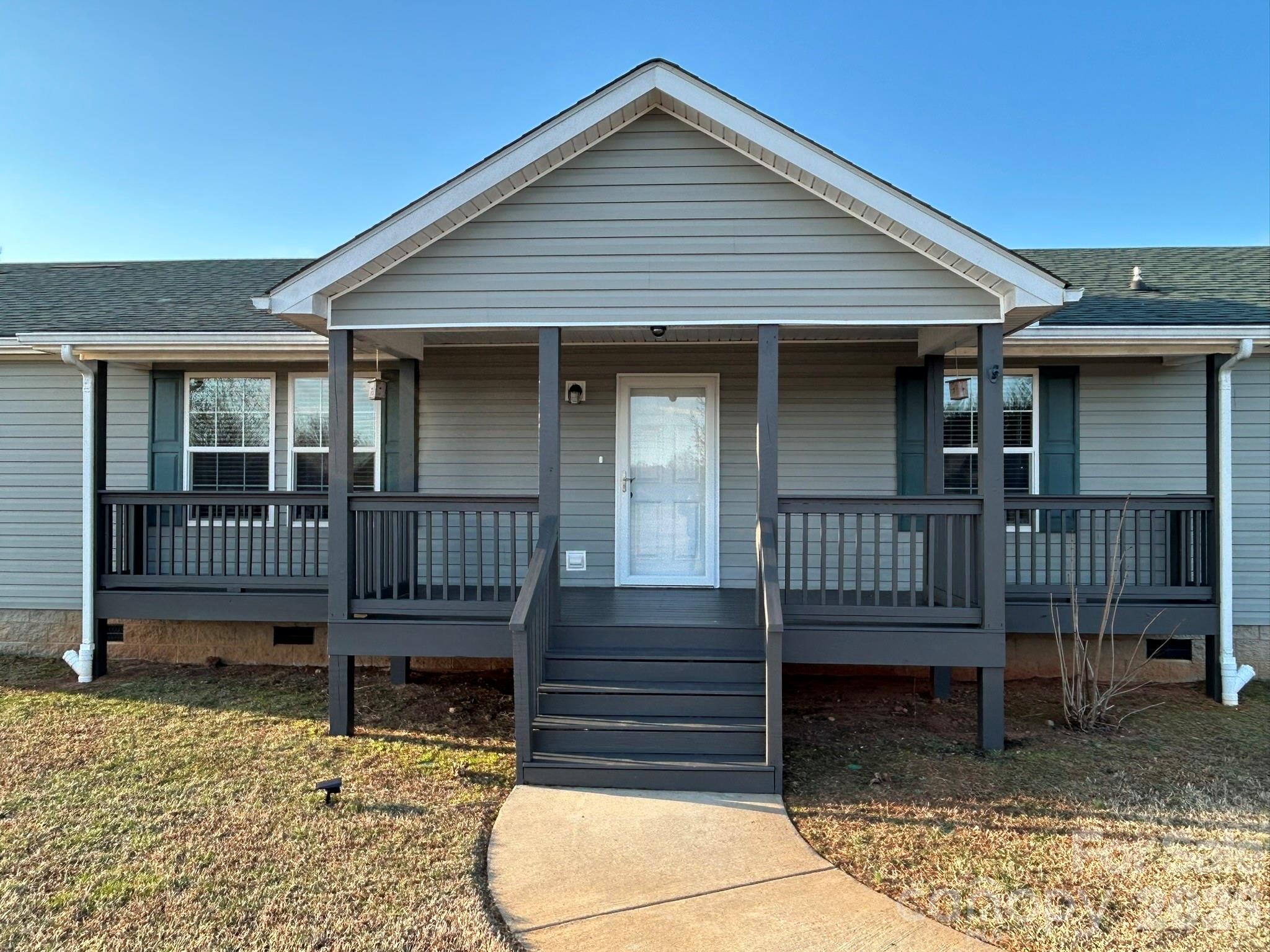 3343 Hollis Road Ellenboro, NC 28040 - Photo 15 of 48 a view of a house with a yard and wooden fence