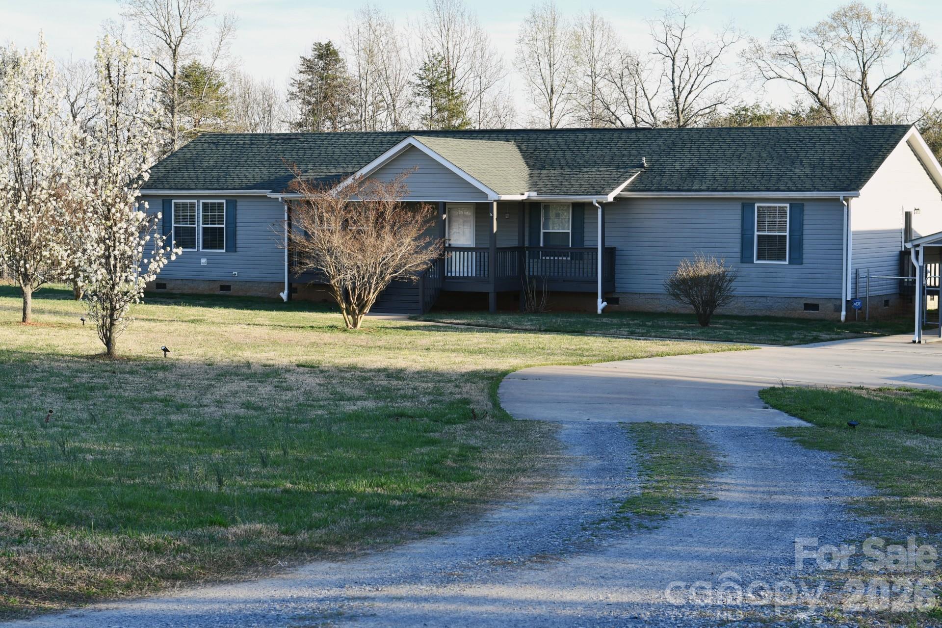 3343 Hollis Road Ellenboro, NC 28040 - Photo 2 of 48 a front view of a house with swimming pool