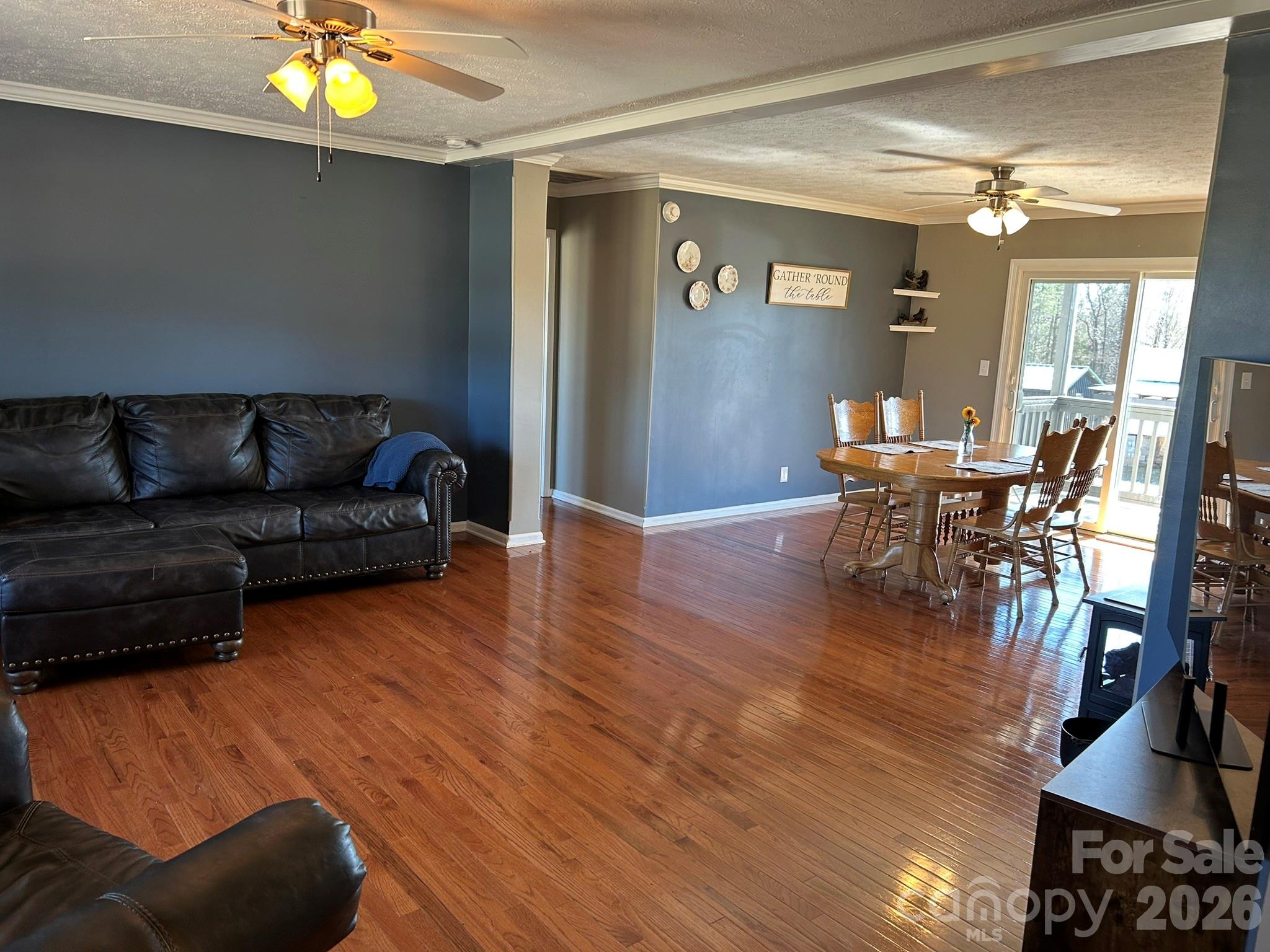 3343 Hollis Road Ellenboro, NC 28040 - Photo 21 of 48 a living room with furniture and a chandelier
