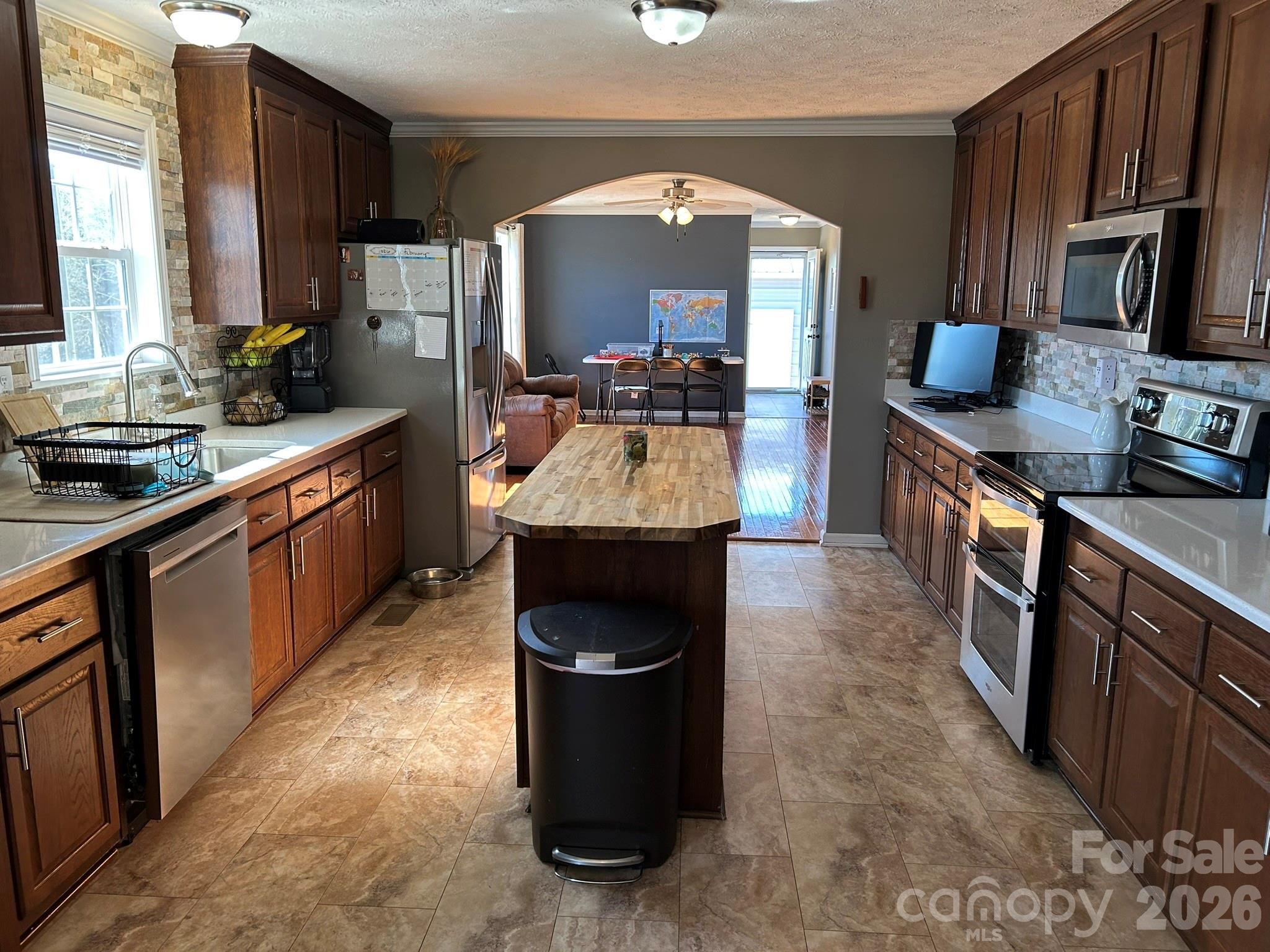 3343 Hollis Road Ellenboro, NC 28040 - Photo 23 of 48 a kitchen with stainless steel appliances granite countertop a stove a sink and a refrigerator