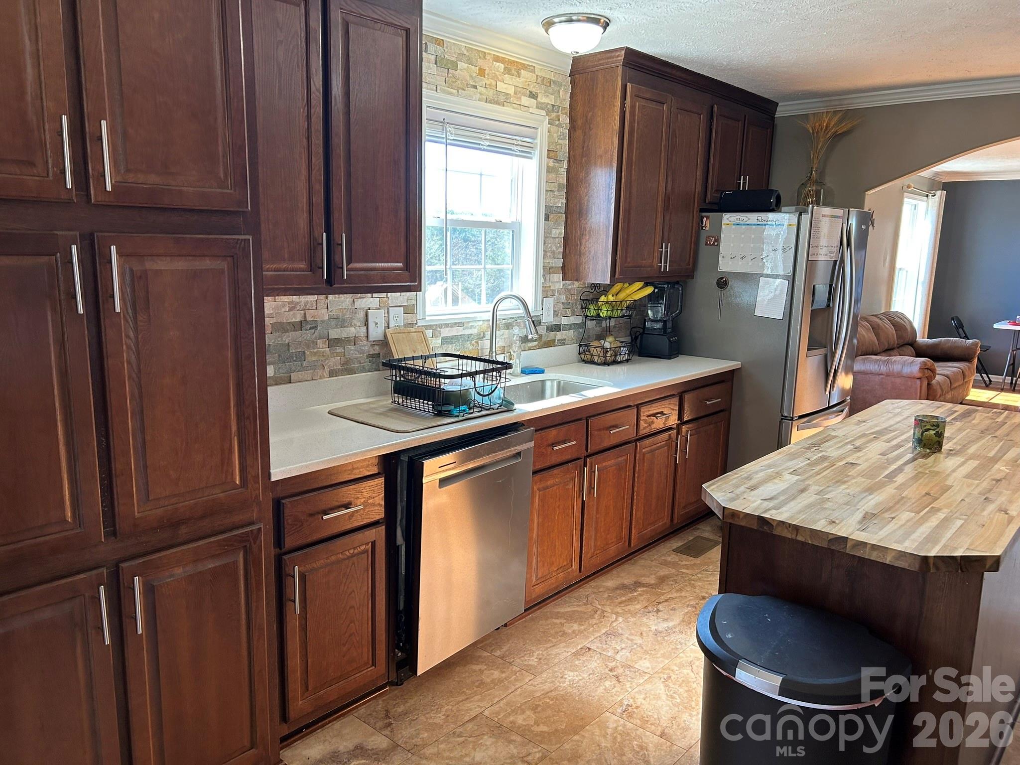 3343 Hollis Road Ellenboro, NC 28040 - Photo 25 of 48 a kitchen with stainless steel appliances granite countertop wooden cabinets a sink and a stove