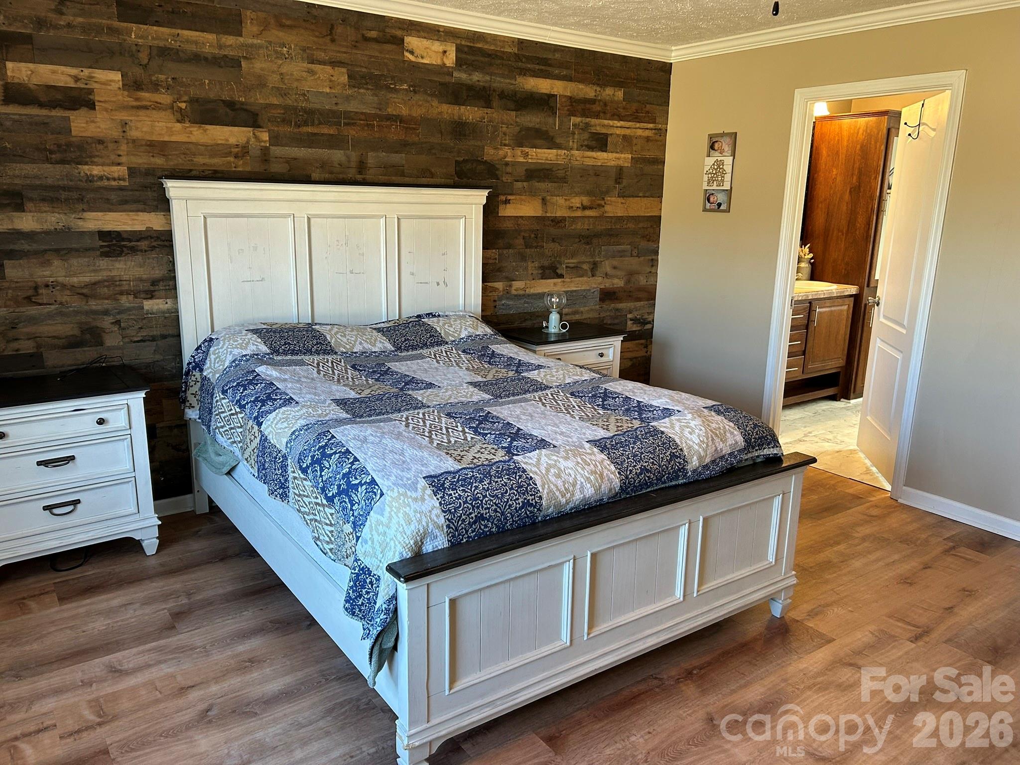 3343 Hollis Road Ellenboro, NC 28040 - Photo 28 of 48 a bedroom with a bed and wooden floor