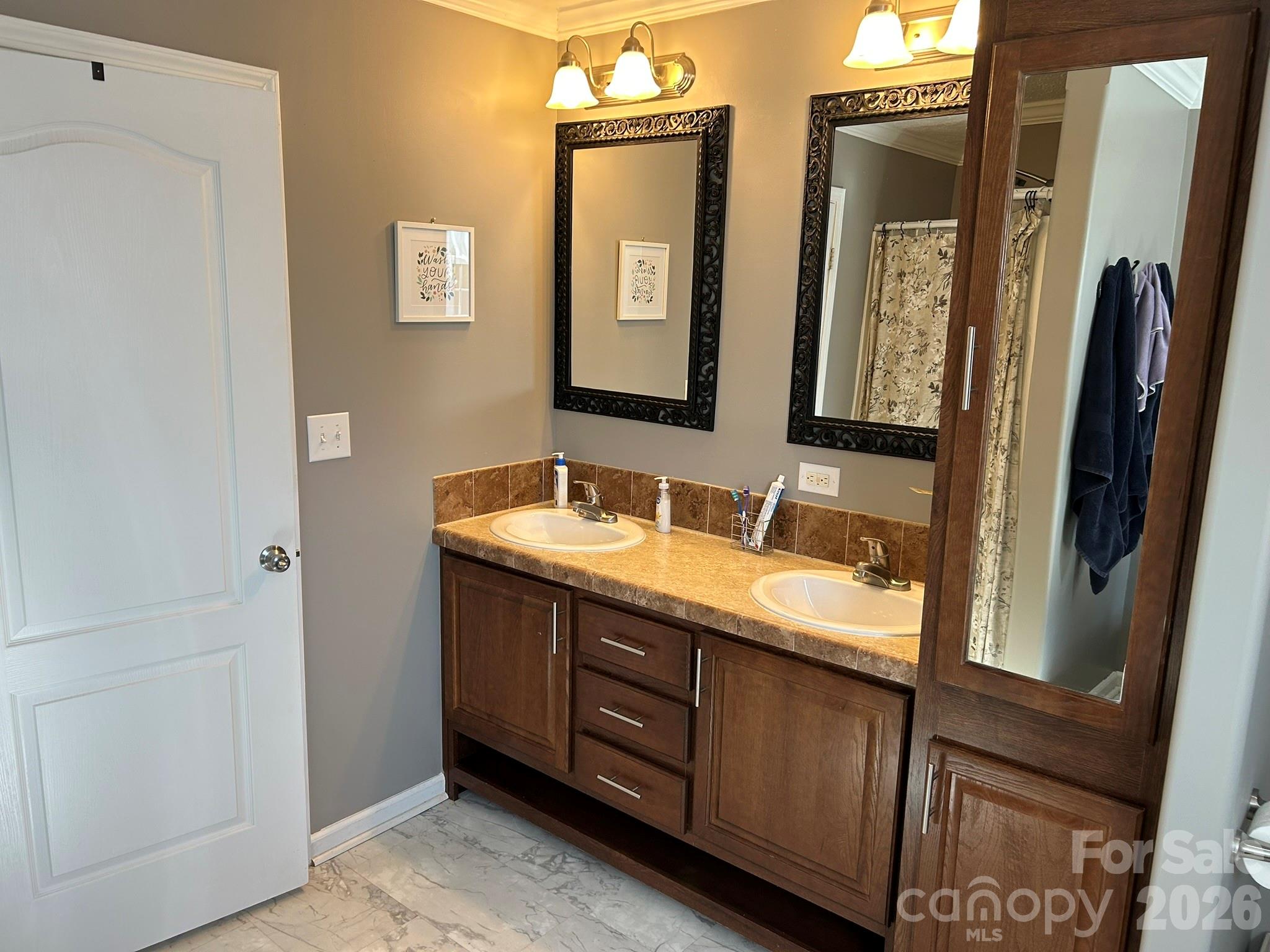3343 Hollis Road Ellenboro, NC 28040 - Photo 30 of 48 a bathroom with a granite countertop double vanity sink and a mirror