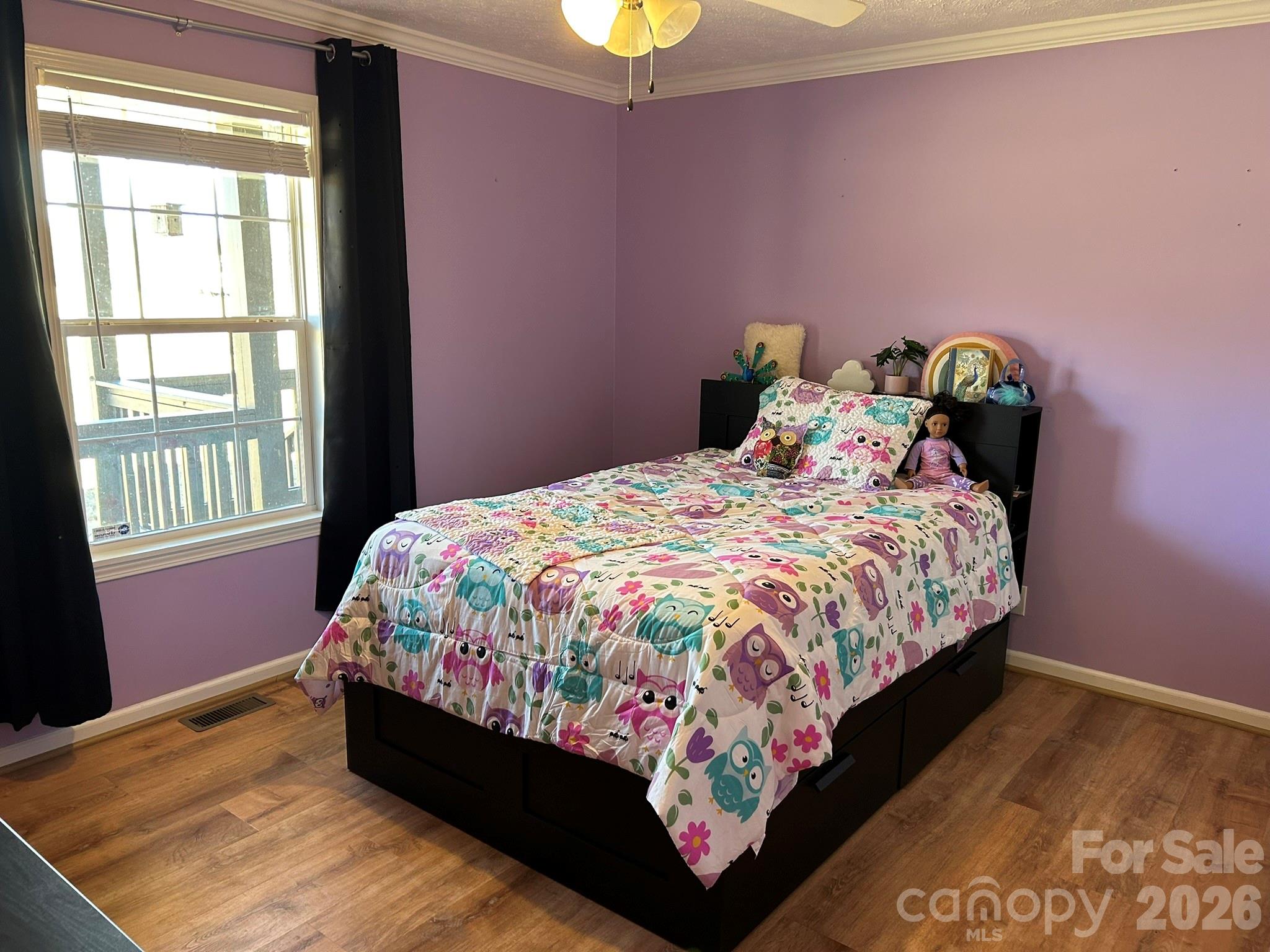 3343 Hollis Road Ellenboro, NC 28040 - Photo 37 of 48 a bed sitting in a bedroom next to a window