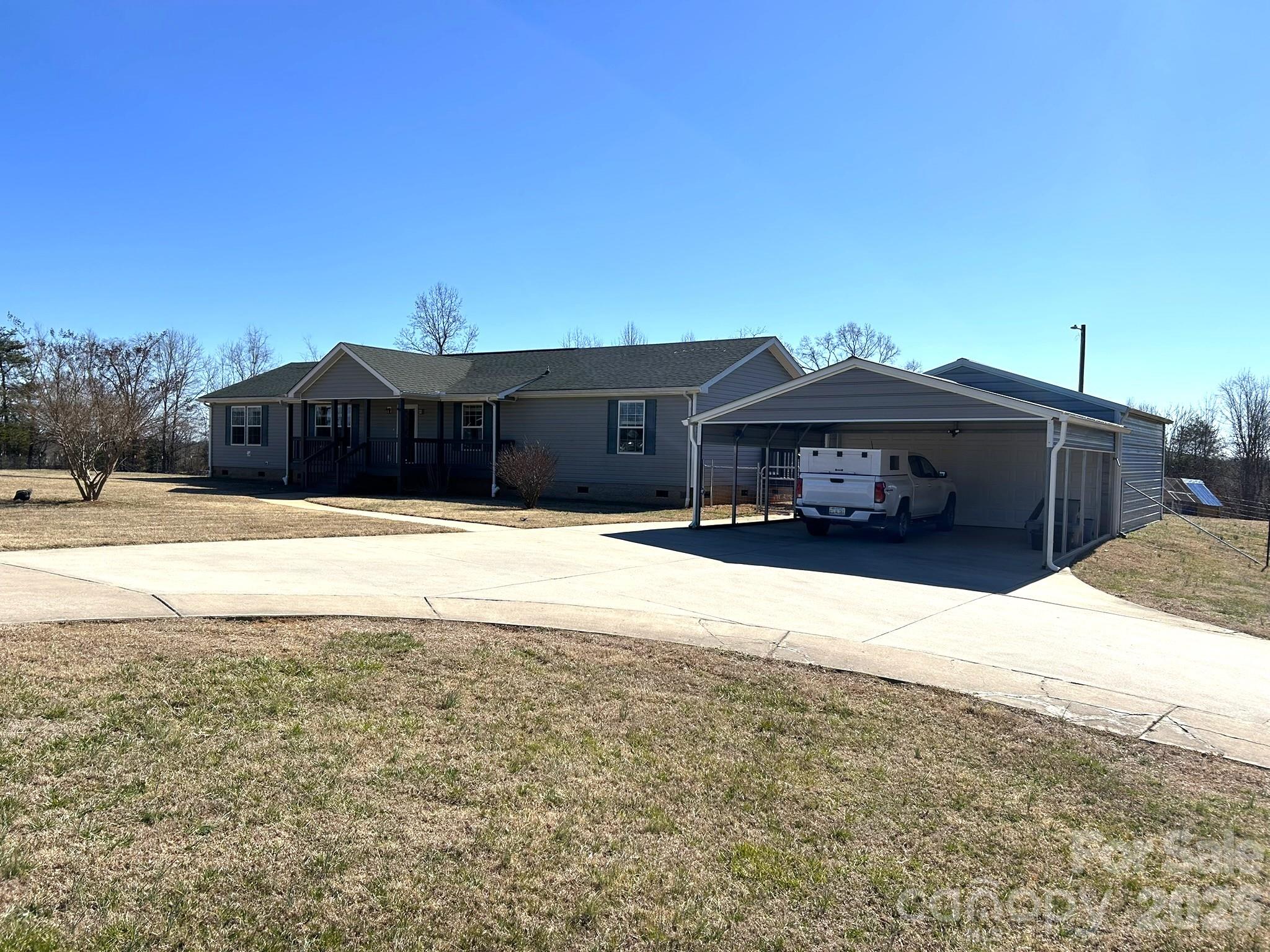 3343 Hollis Road Ellenboro, NC 28040 - Photo 47 of 48 a view of a house with a yard covered with snow in front of house