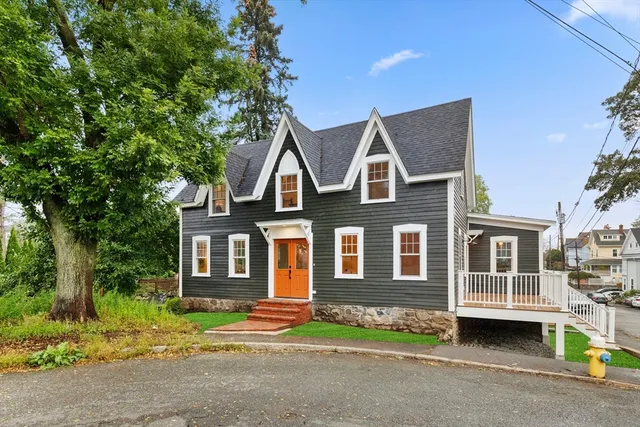 a front view of a house with a yard