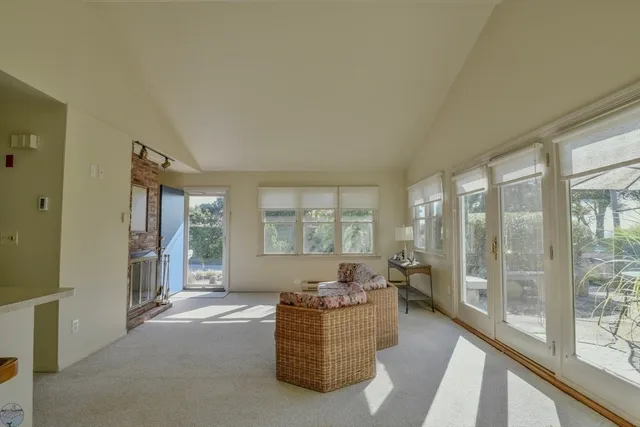 a living room with furniture and windows