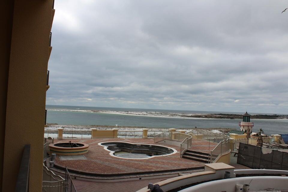 10 Harbor Boulevard, Unit 203B Destin, FL 32541 - Photo 18 of 18 a view of a terrace with food and stove