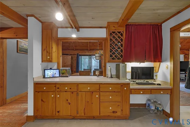 a bedroom with furniture and large windows