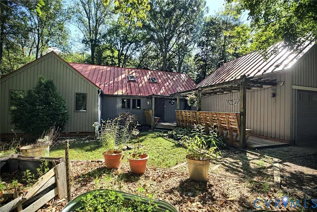 a front view of a house with sitting area