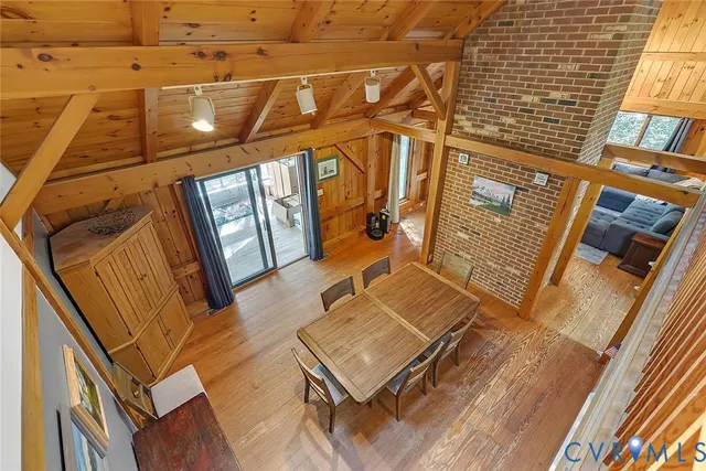 a view of a balcony with wooden floor