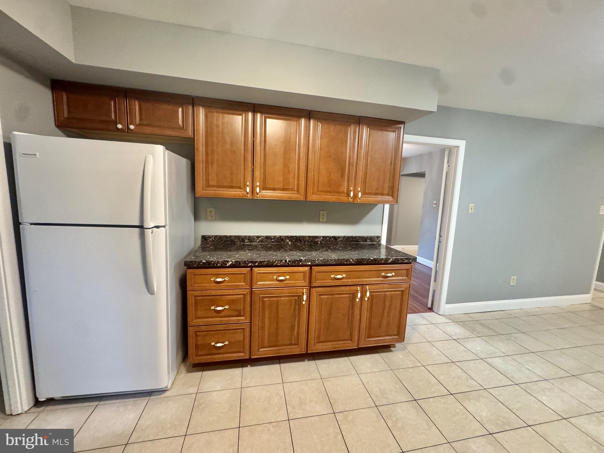 4908 Rocky Spring Lane Bowie, MD 20715 - Photo 10 of 36 a kitchen with stainless steel appliances granite countertop a refrigerator and a stove
