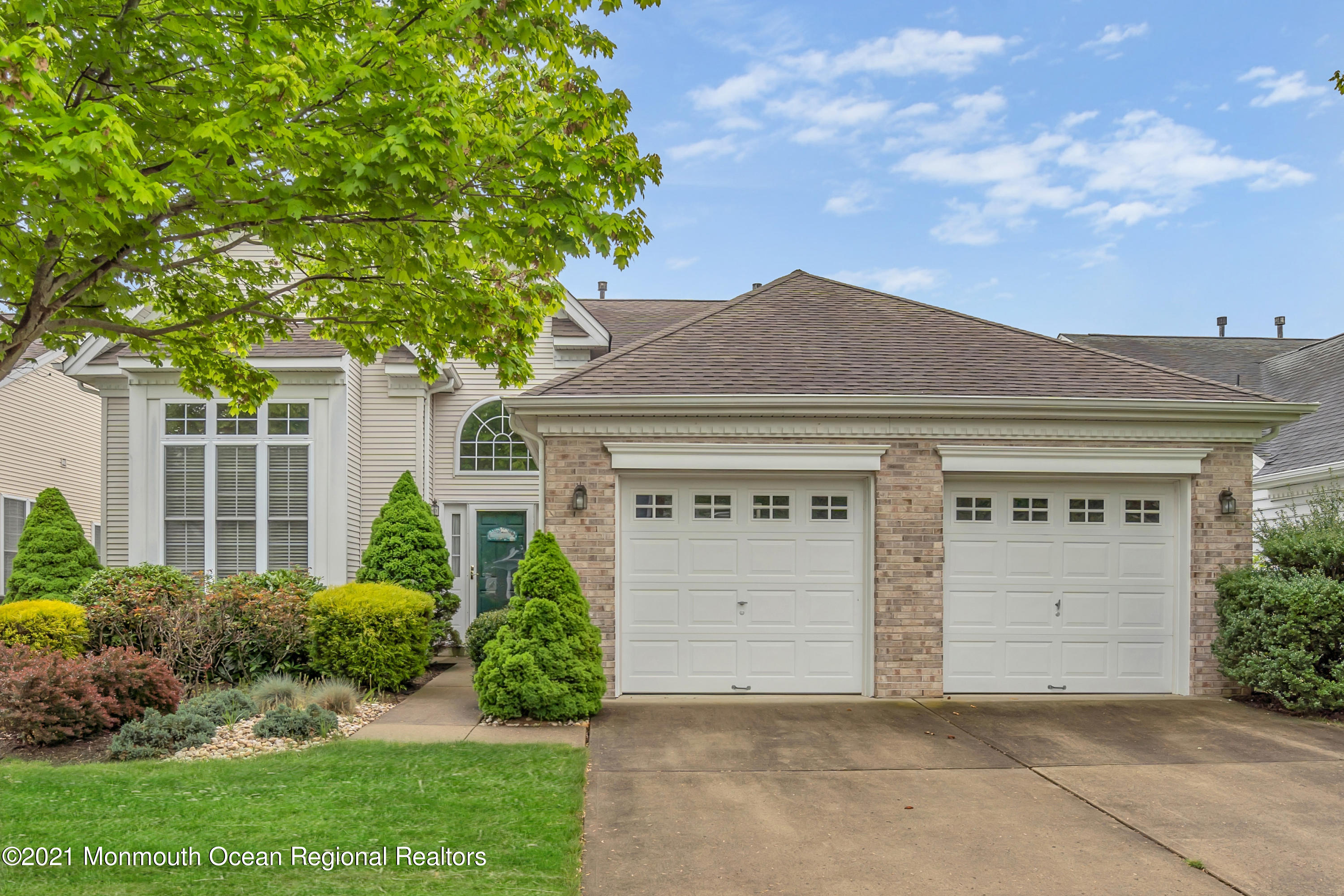 55 Shoal Road Jackson, NJ 08527 - Photo 1 of 55 front view of a house with a garden