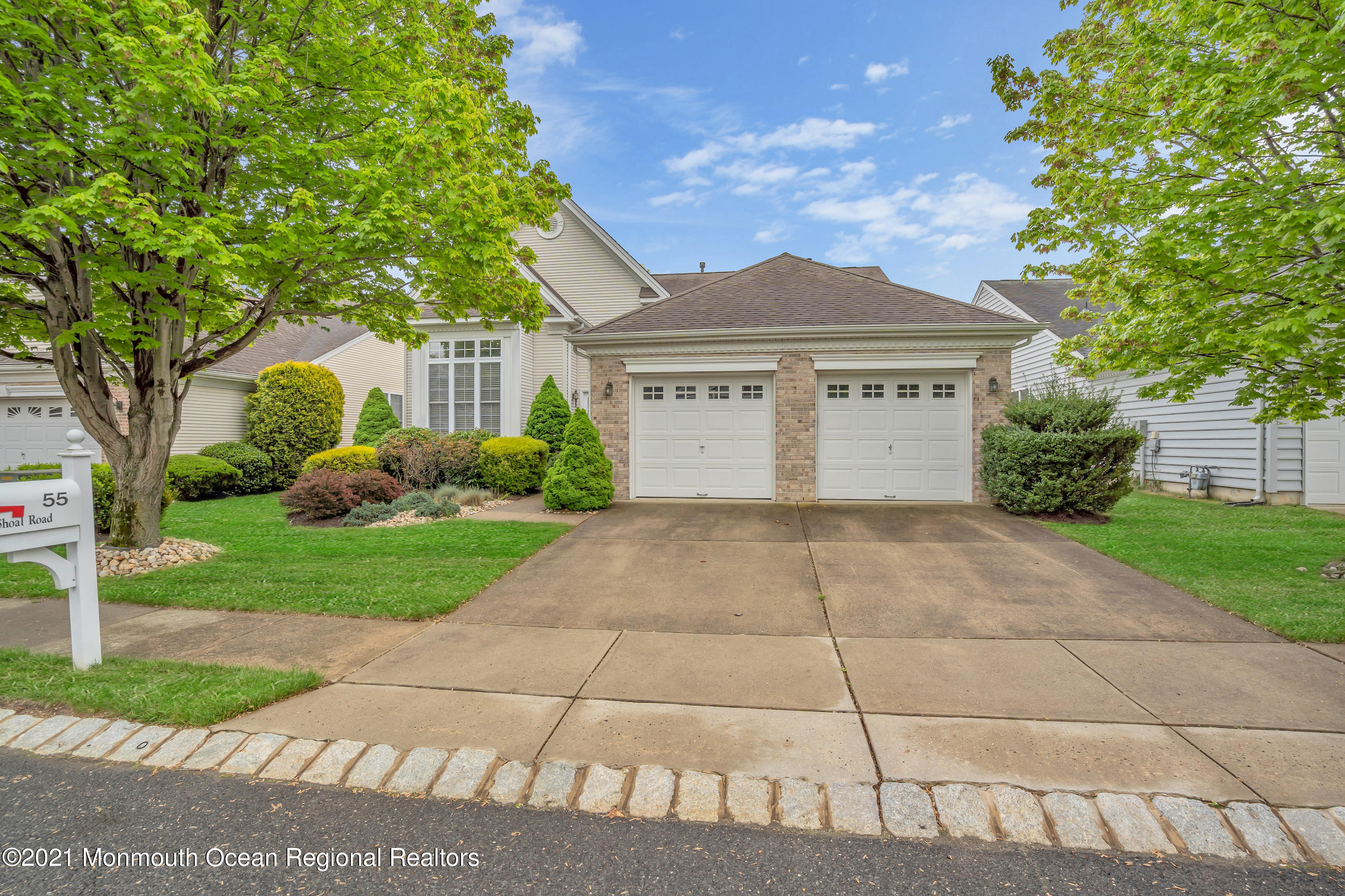 55 Shoal Road Jackson, NJ 08527 - Photo 2 of 55 a front view of a house with garden