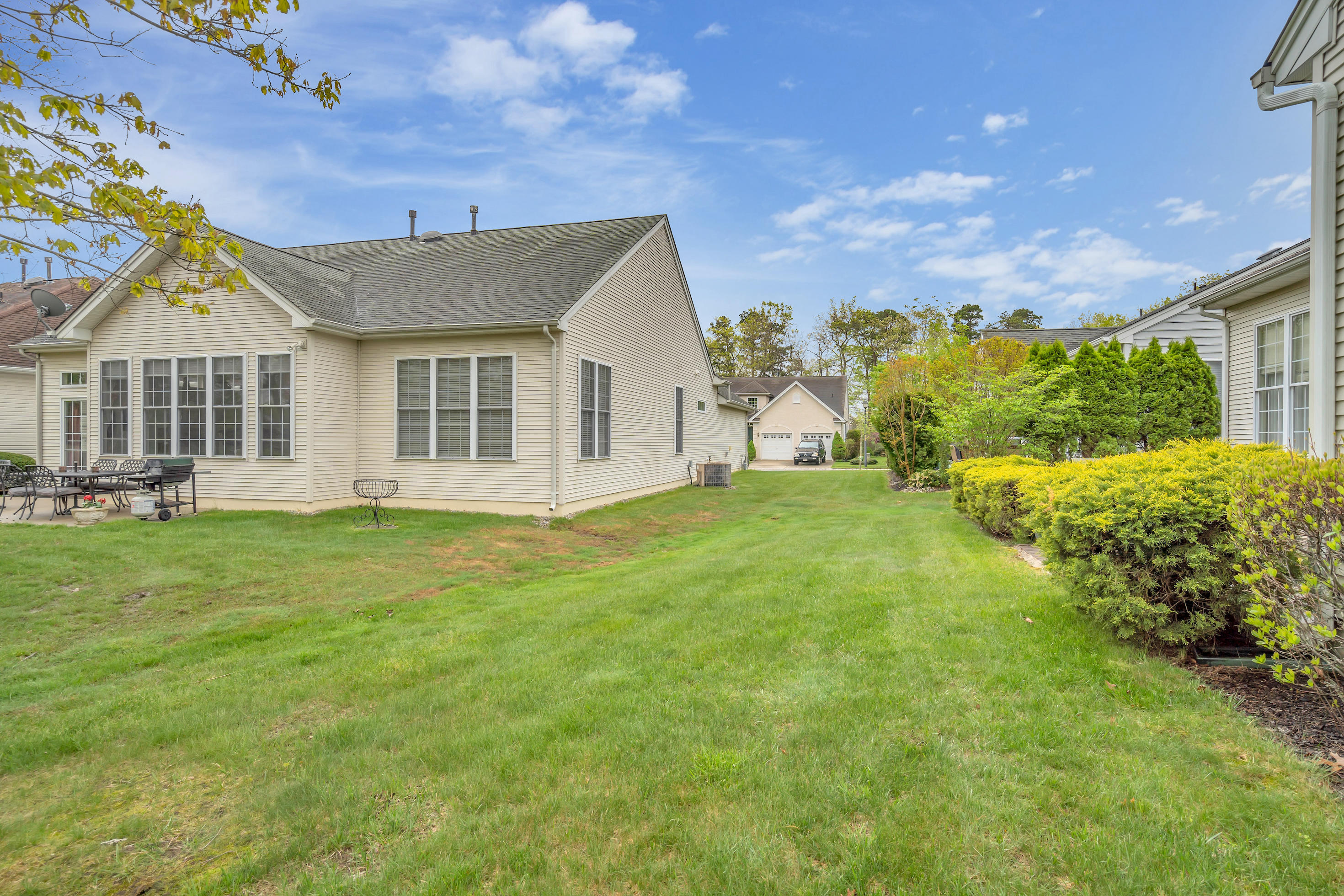 55 Shoal Road Jackson, NJ 08527 - Photo 30 of 55 a front view of a house with a garden