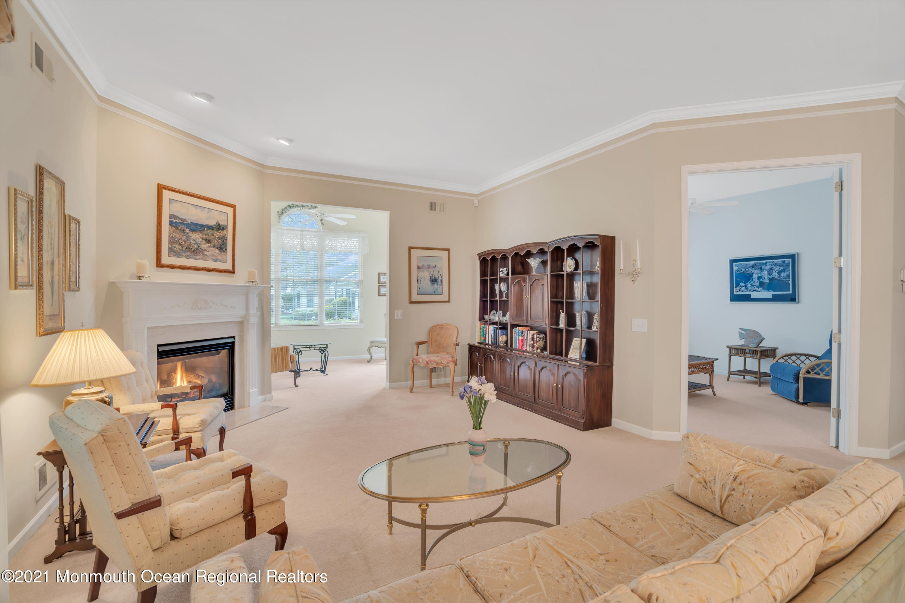 55 Shoal Road Jackson, NJ 08527 - Photo 31 of 55 a living room with furniture and a fireplace