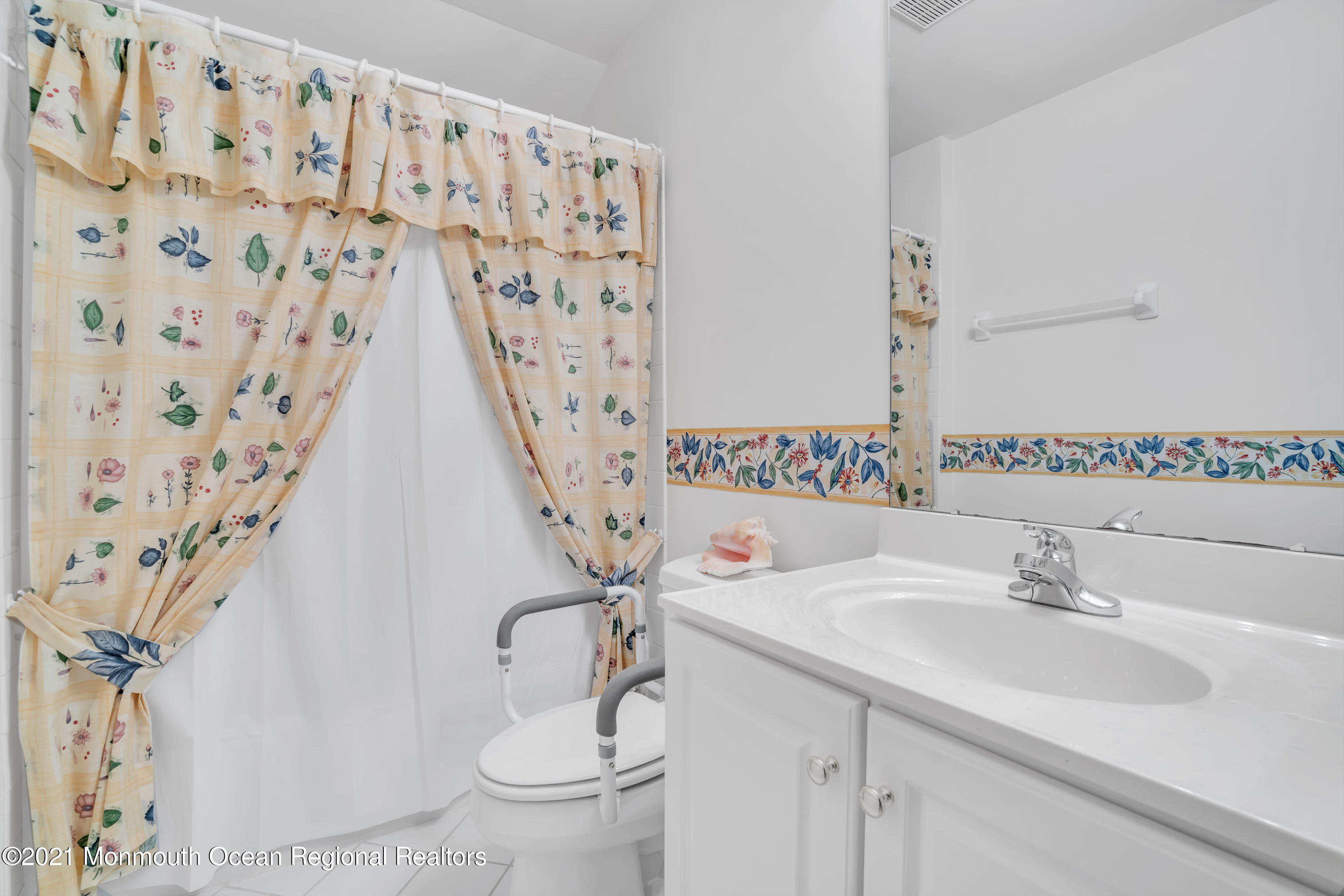 55 Shoal Road Jackson, NJ 08527 - Photo 43 of 55 a bathroom with a sink and a mirror