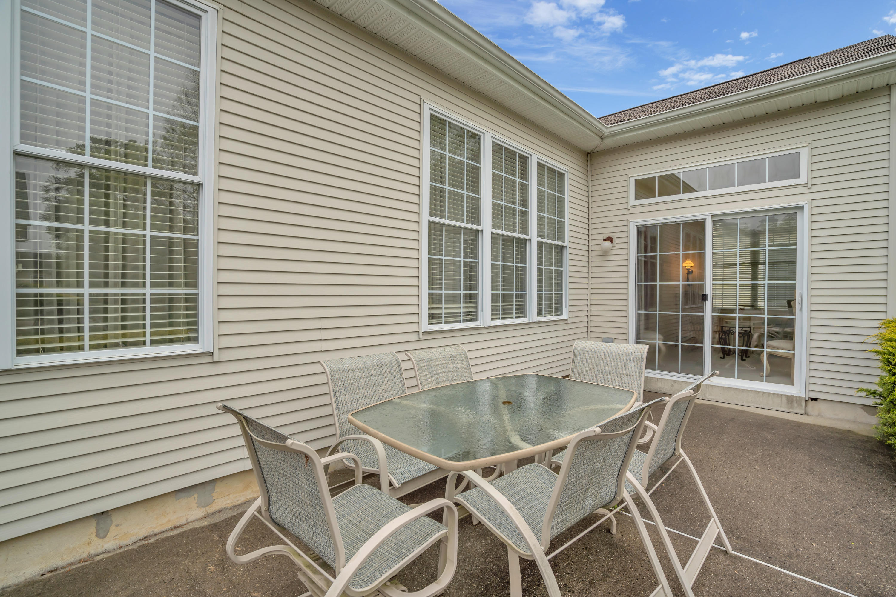 55 Shoal Road Jackson, NJ 08527 - Photo 46 of 55 a table and chairs in front of a house
