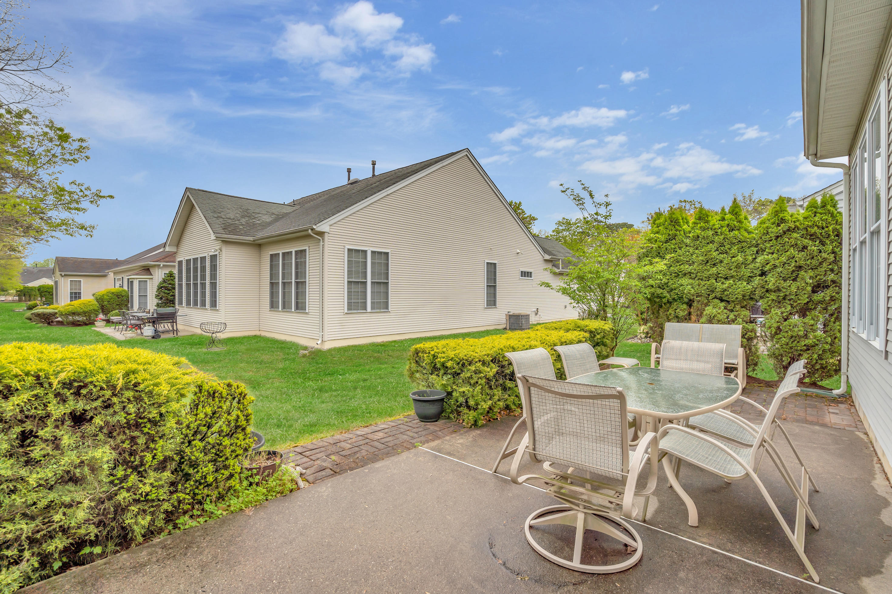 55 Shoal Road Jackson, NJ 08527 - Photo 7 of 55 a view of a patio with table and chairs and potted plants